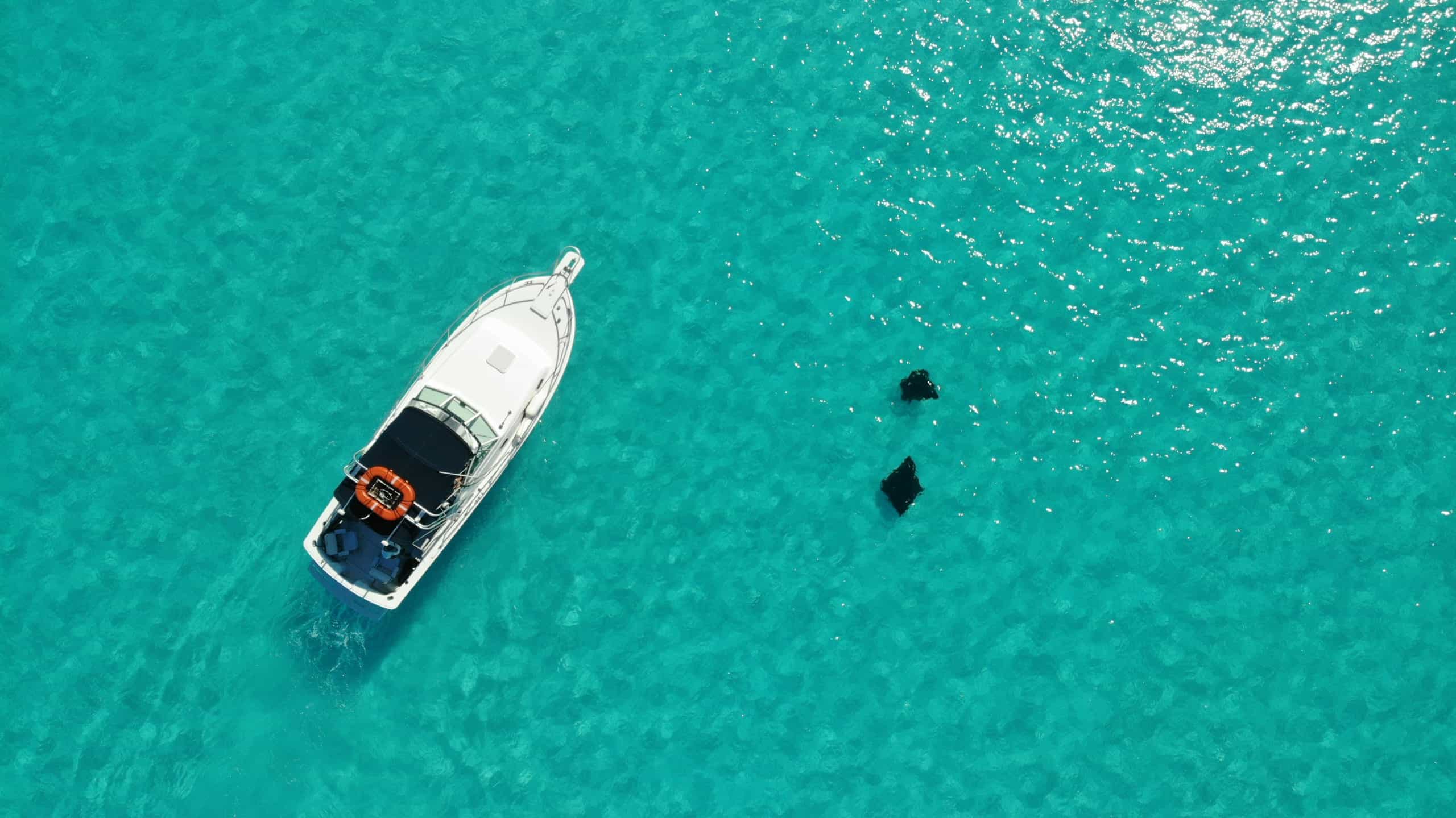 Yacht cruising the crystal-clear waters of the Italian coast